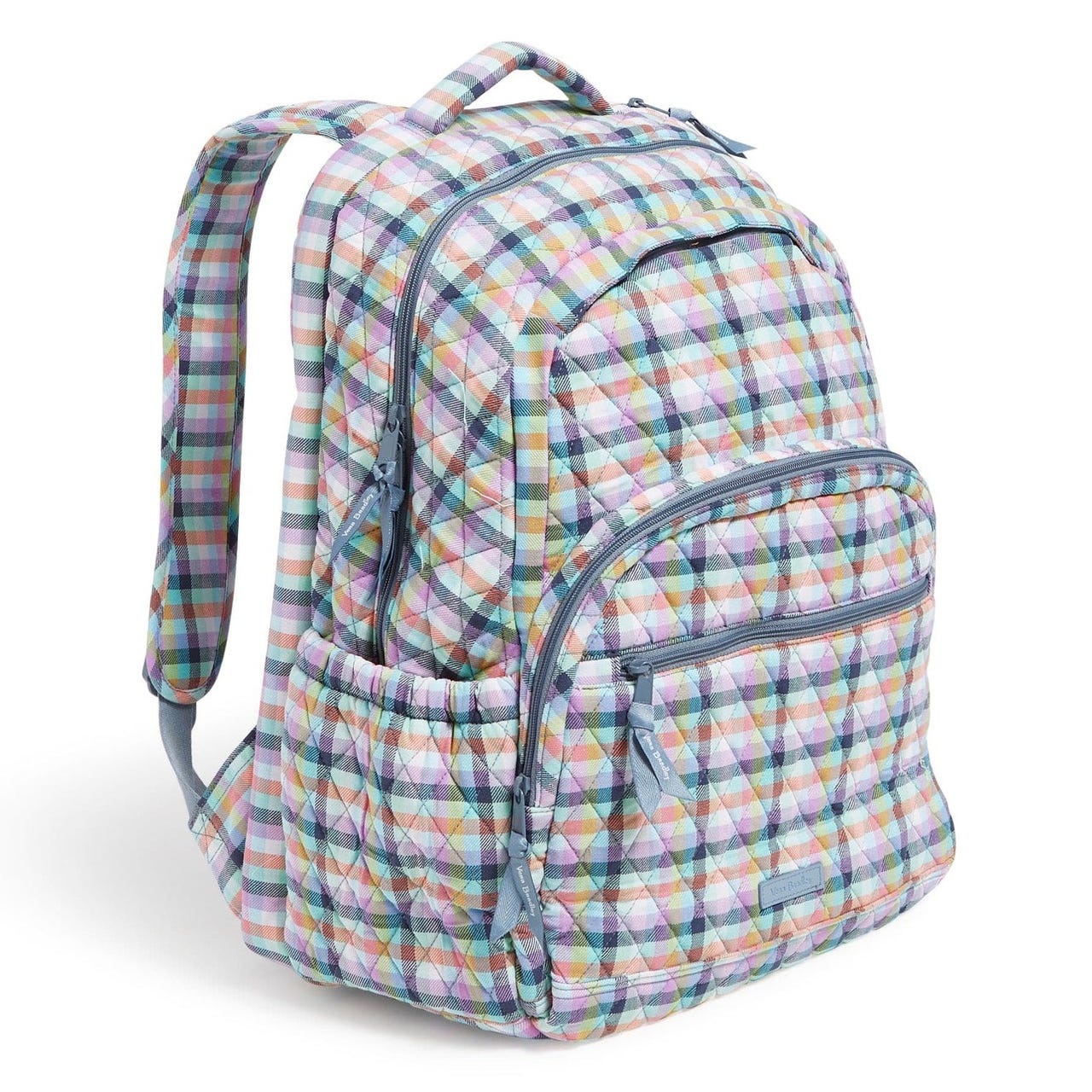 A quilted backpack with a colorful plaid pattern features multiple zippered compartments and side pockets, designed for everyday use.