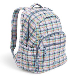 A quilted backpack with a colorful plaid pattern features multiple zippered compartments and side pockets, designed for everyday use.
