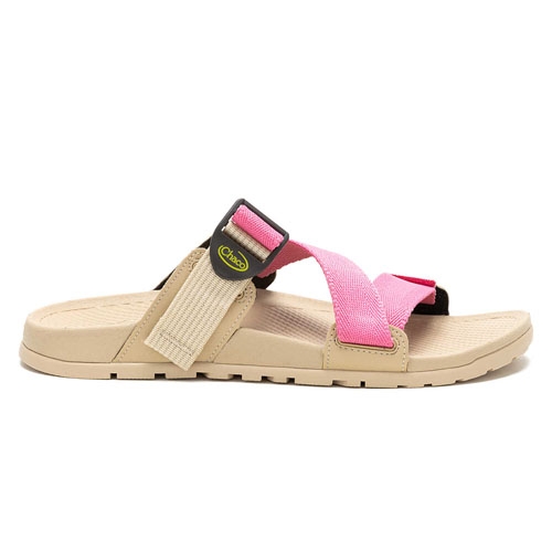 Chaco Lowdown Slides feature a tan sole with a pink and tan adjustable strap equipped with a buckle for secure fit. The footbed is contoured for comfort and the outsole is lightly treaded for traction.