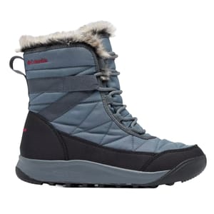 Columbia Shorty IV Boots feature a quilted blue upper with black accents, a lace-up closure, faux fur trim at the top, and a durable outsole designed for winter conditions.