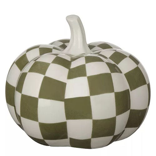 A decorative ceramic pumpkin featuring a green and white checkered pattern.