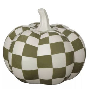 A decorative ceramic pumpkin featuring a green and white checkered pattern.