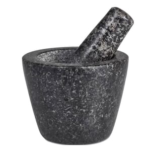 Granite mortar and pestle set in a mottled black and gray stone design, used for grinding and mixing ingredients.