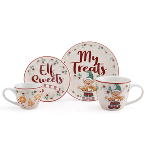 A festive kitchen set featuring two mugs and two plates with \“Elf Sweets\“ and \“My Treats\“ written on them, decorated with holly, candy canes, and elves holding cookies.