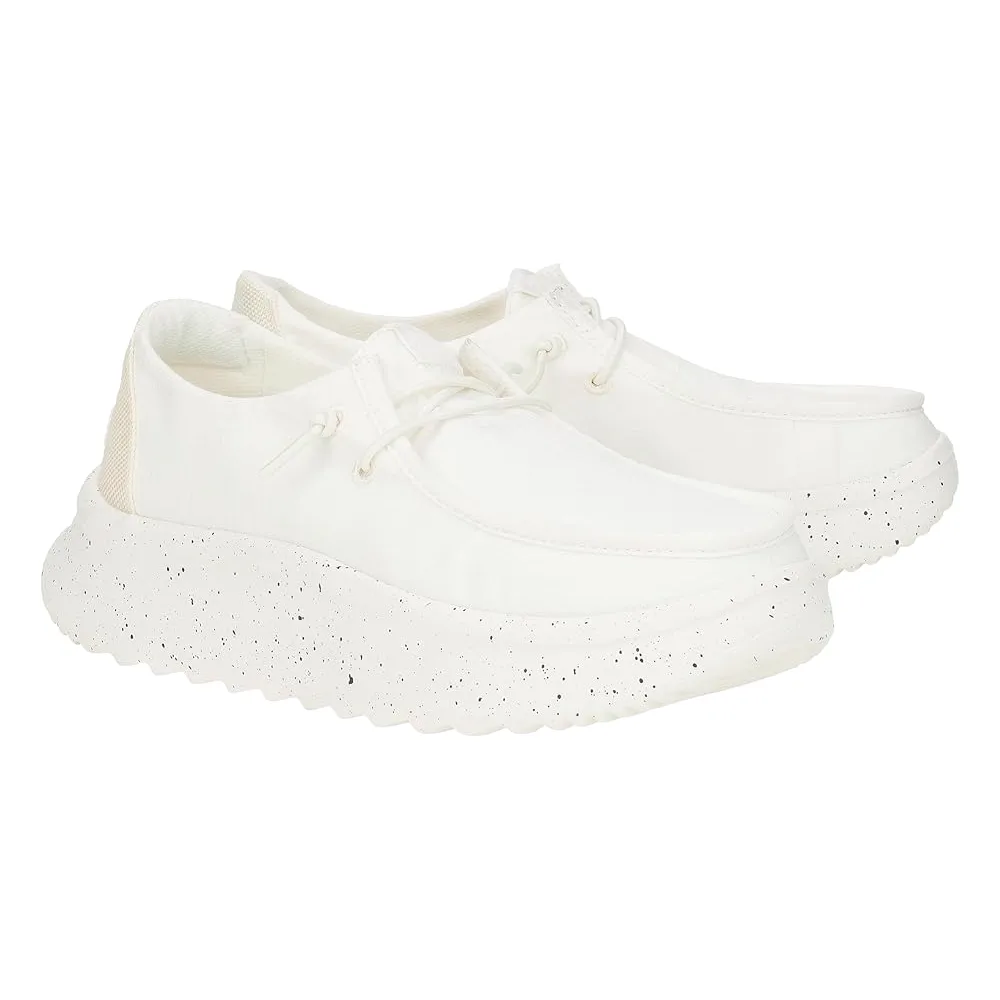 White Hey Dude Wendy Peak Platform Shoes featuring thick rounded speckled soles, a low-top design, and lace-up closure, combining casual comfort with a modern chunky style.
