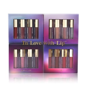 16-piece set of lip products with gold caps, including liquid lipsticks and lip glosses in various shades, packaged in gradient purple boxes labeled as Liquid Lipstick, Neutral Lip Gloss, Berry Lip Gloss, and Lip Oil.