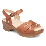 A tan leather sandal with a low wooden-look block heel, featuring crisscross straps and an adjustable ankle strap with a buckle.