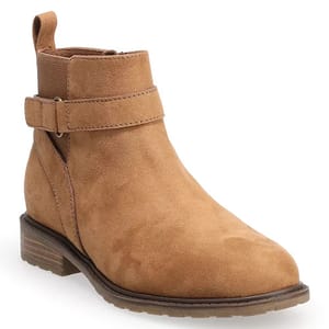 Brown suede ankle boot with a low heel, side cut-out detail, and strap buckle accent.