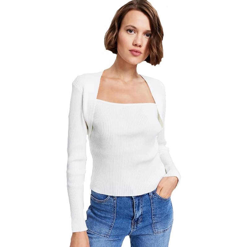 White shrug rib-knit long-sleeve sweater with a square neckline, paired with blue jeans. The design is fitted and minimalist, suitable for casual or semi-casual wear.