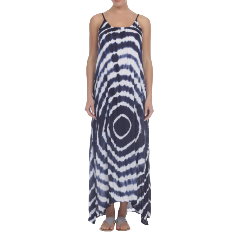 A sleeveless tie-dye maxi dress featuring a navy and white circular pattern, with thin shoulder straps and an ankle-length hemline, paired with flat sandals.