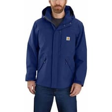 A blue Carhartt Storm Defender Jacket, featuring a hood, front zipper, snap closure, and multiple pockets for functionality. It has the Carhartt logo on the chest.