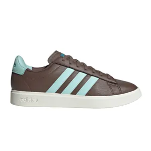 Brown Adidas sneakers with light blue stripes and a white sole.