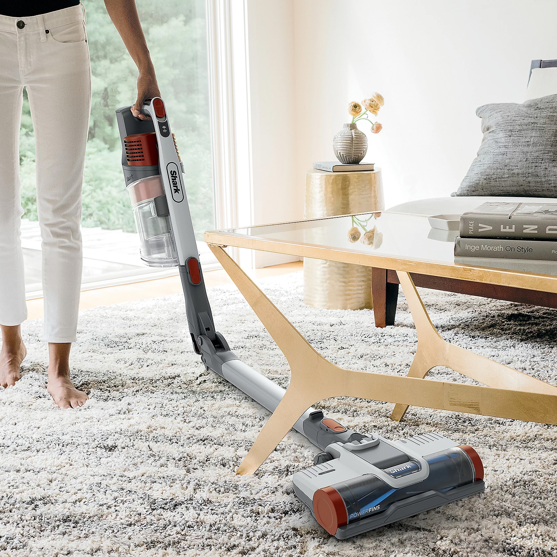 The Shark Pet Pro Multiflex Stick Vacuum features a flexible design for cleaning under furniture, a handheld mode for versatility, and strong suction for pet hair. It includes a detachable dustbin and an articulated wand for easy maneuverability.