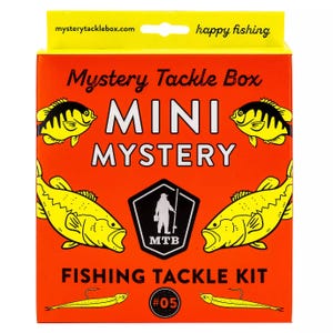 The Mini Mystery Fishing Tackle Kit from Mystery Tackle Box includes various fishing lures and tackle, featuring a vibrant orange box with fish illustrations, labeled as \“happy fishing\“ and \“#05.\“