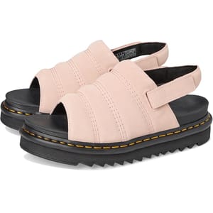 Pink, open-toe sandals with thick black soles and bold yellow stitching. They feature a slingback strap and textured sole for added grip.