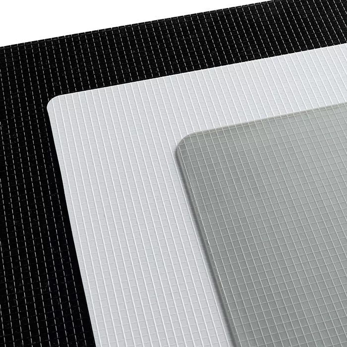 Three self-healing cutting mats in black, white, and grey, each featuring grid lines for precision cutting.