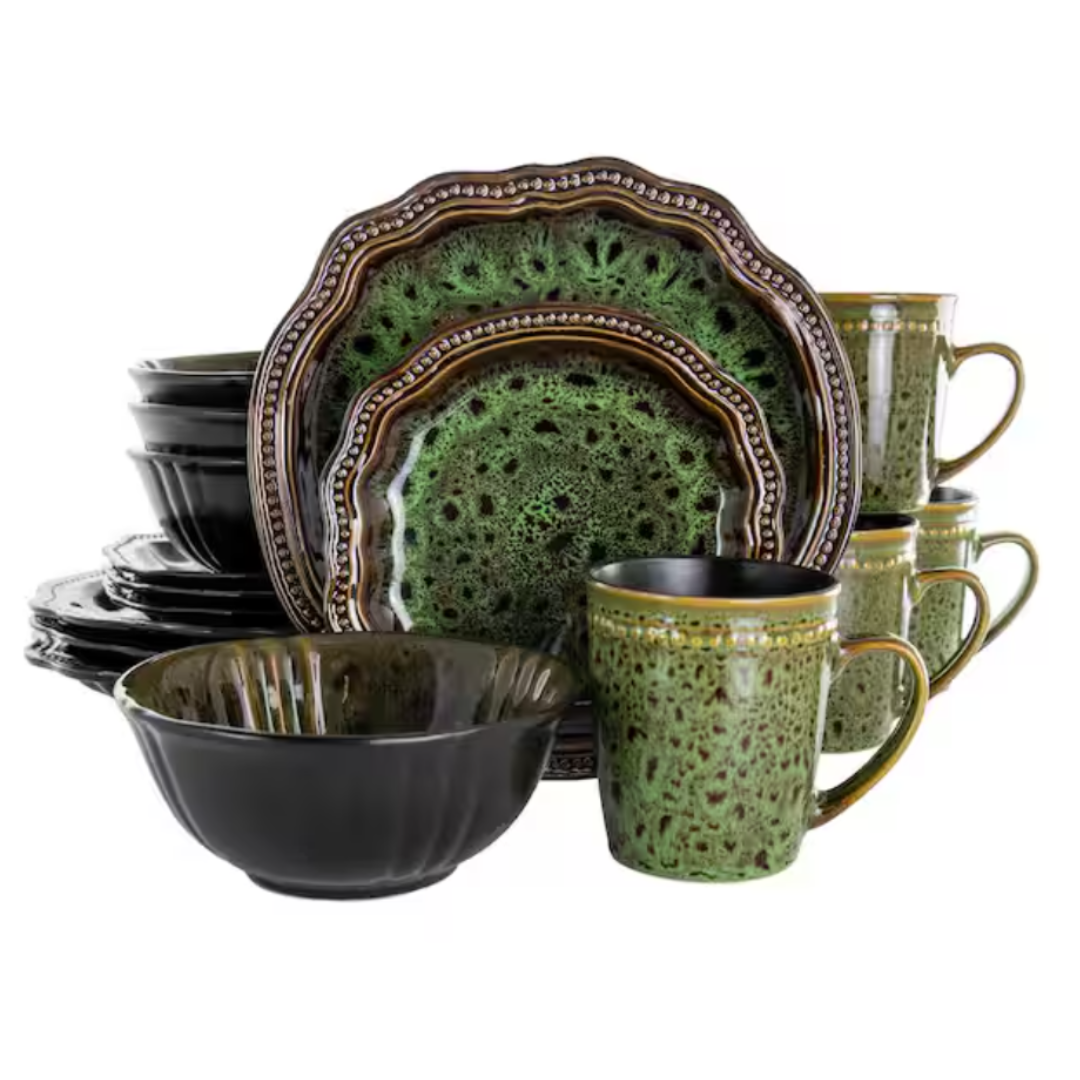 Eight-piece dinnerware set in a green and black glaze, featuring dinner plates, salad plates, bowls, and mugs with a textured, ornate design.