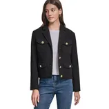 A woman is wearing a black tailored jacket with gold buttons, featuring two chest pockets and two lower pockets. She pairs it with a gray top and blue jeans.