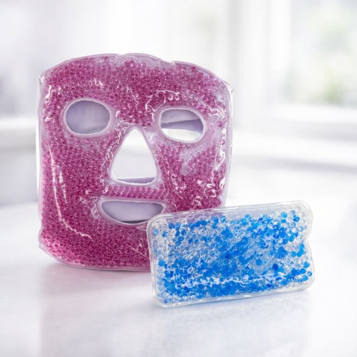 A pink gel bead face mask and a rectangular blue gel bead pack, likely designed for cooling or heating therapy.