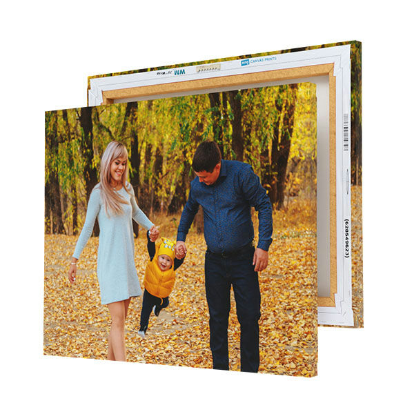 Three custom canvas prints feature a moment of a family walking through a leaf-strewn path, with the parents swinging their child by the arms. Free shipping is offered for these items.