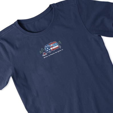 Navy blue short-sleeved tee for women featuring a small graphic of a camper with an American flag design on the left chest area.