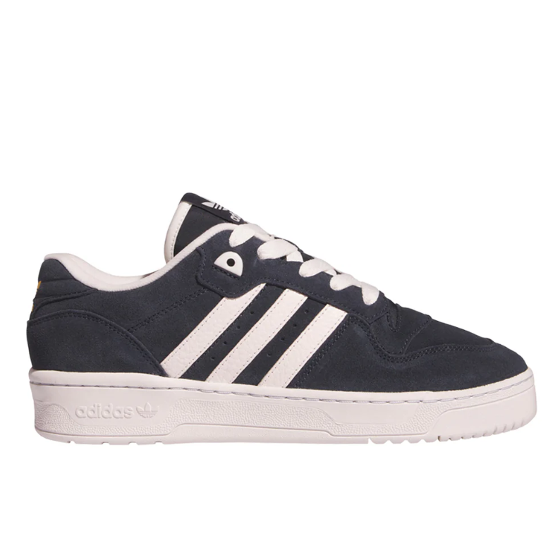 Navy and white Adidas sneakers featuring the signature three stripes design with a textured sole and lace-up closure.