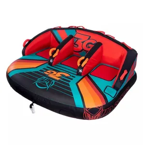 Inflatable towable tube designed for water sports, featuring two seats with backrests, vivid red, orange, and aqua colors, and secure handles for grip.