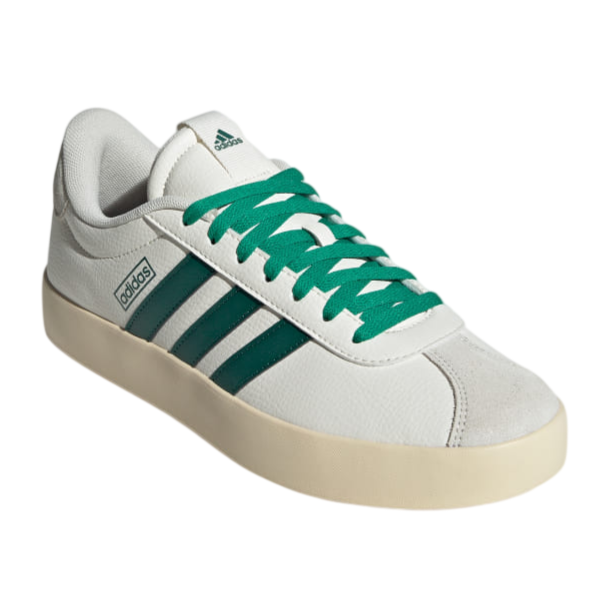 Adidas white sneaker with green stripes and laces, featuring a cream sole and logo accents.