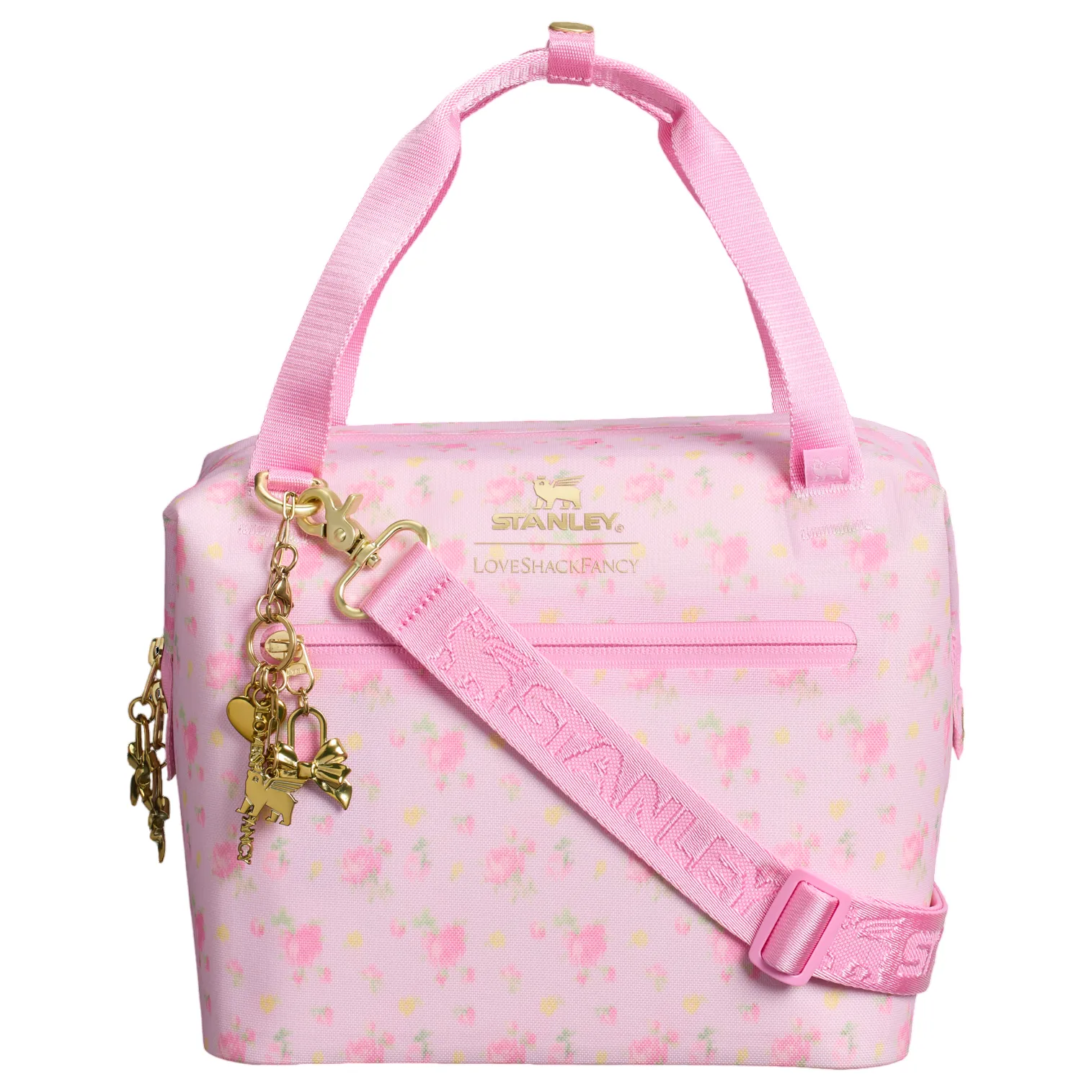 A pink floral Stanley and LoveShackFancy collaboration cooler bag with gold accents and charms, featuring a shoulder strap and top handles.