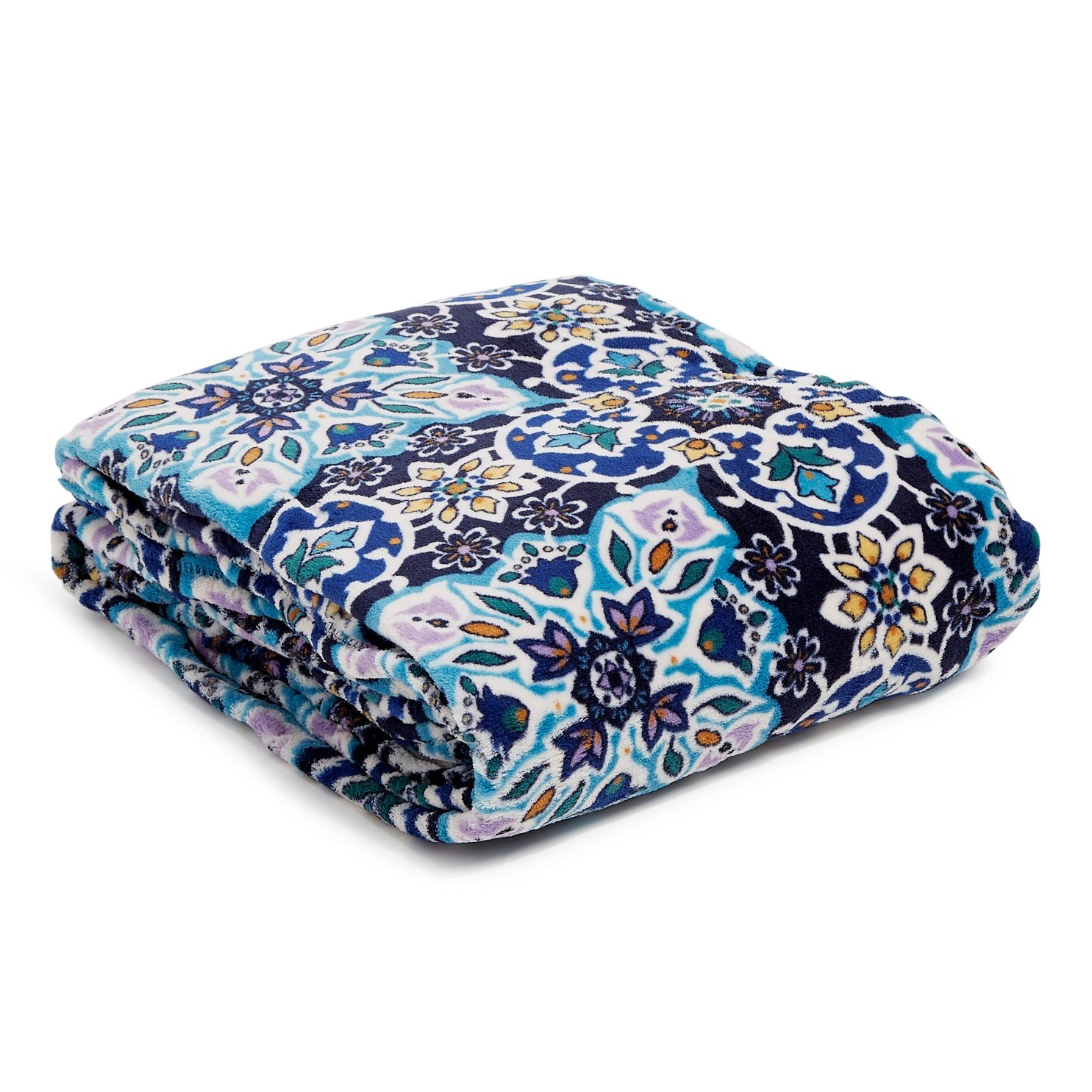A folded blanket featuring a colorful, intricate floral and geometric pattern in shades of blue, teal, purple, and yellow.