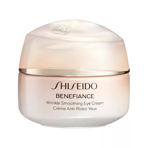Shiseido Benefiance Wrinkle Smoothing Eye Cream is designed to reduce the appearance of wrinkles around the eyes. It comes in a round, light-colored jar with a gold accent.