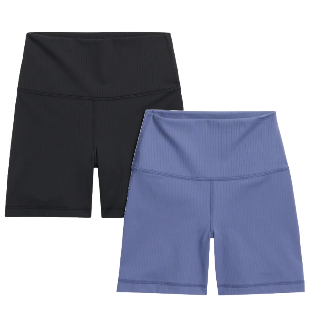 Two pairs of high-waisted bike shorts, one black and one blue, featuring a sleek design with a ribbed texture.