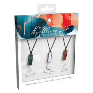 Trinity Gemstone Necklace Set featuring Emerald for renewal, Moonstone for intuition, and Ruby for passion, each pendant on a black cord.