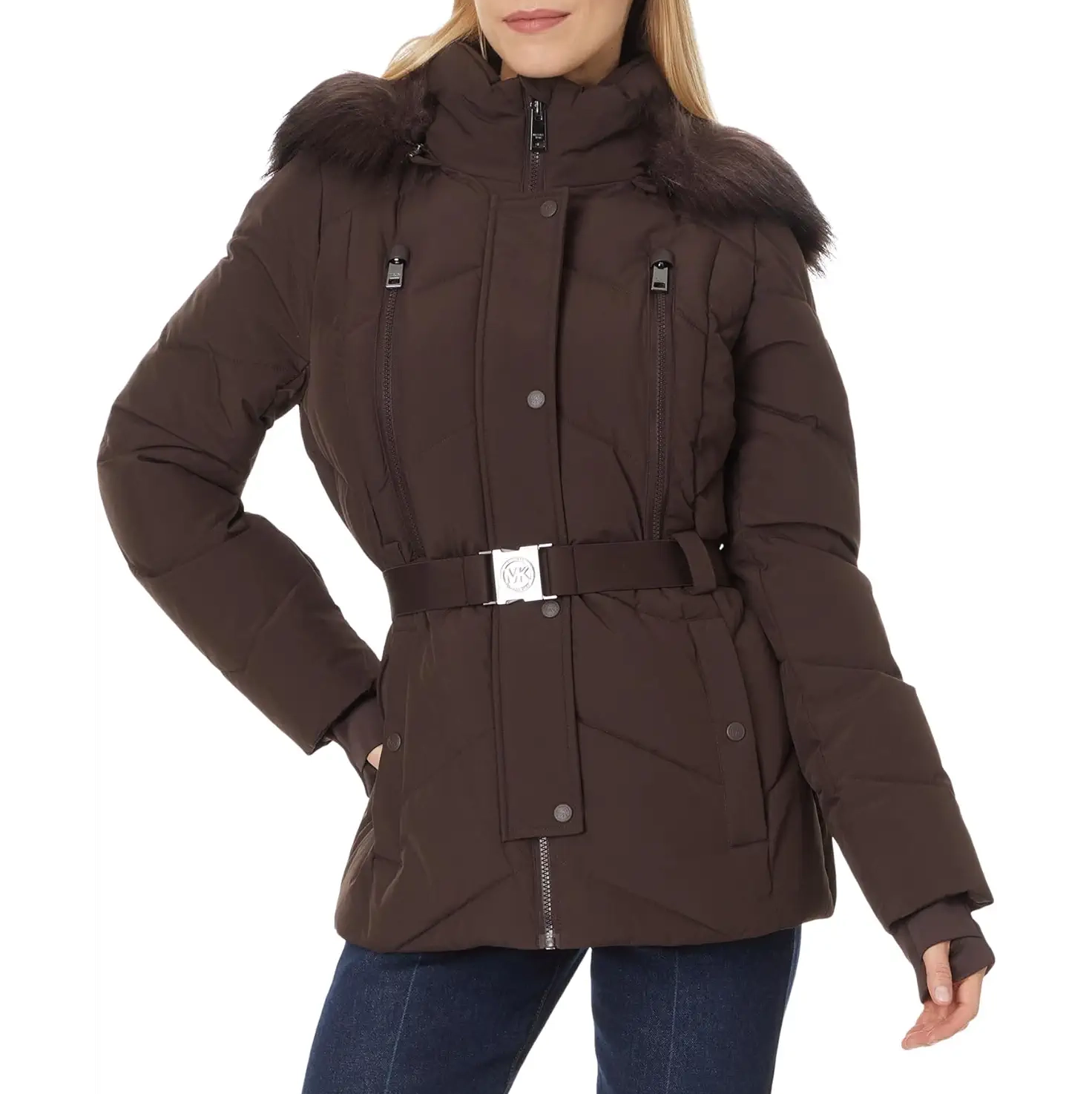 Woman wearing a brown belted puffer jacket with a fur-trimmed hood and front pockets.