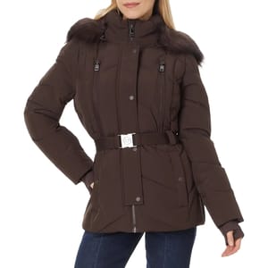 Woman wearing a brown belted puffer jacket with a fur-trimmed hood and front pockets.