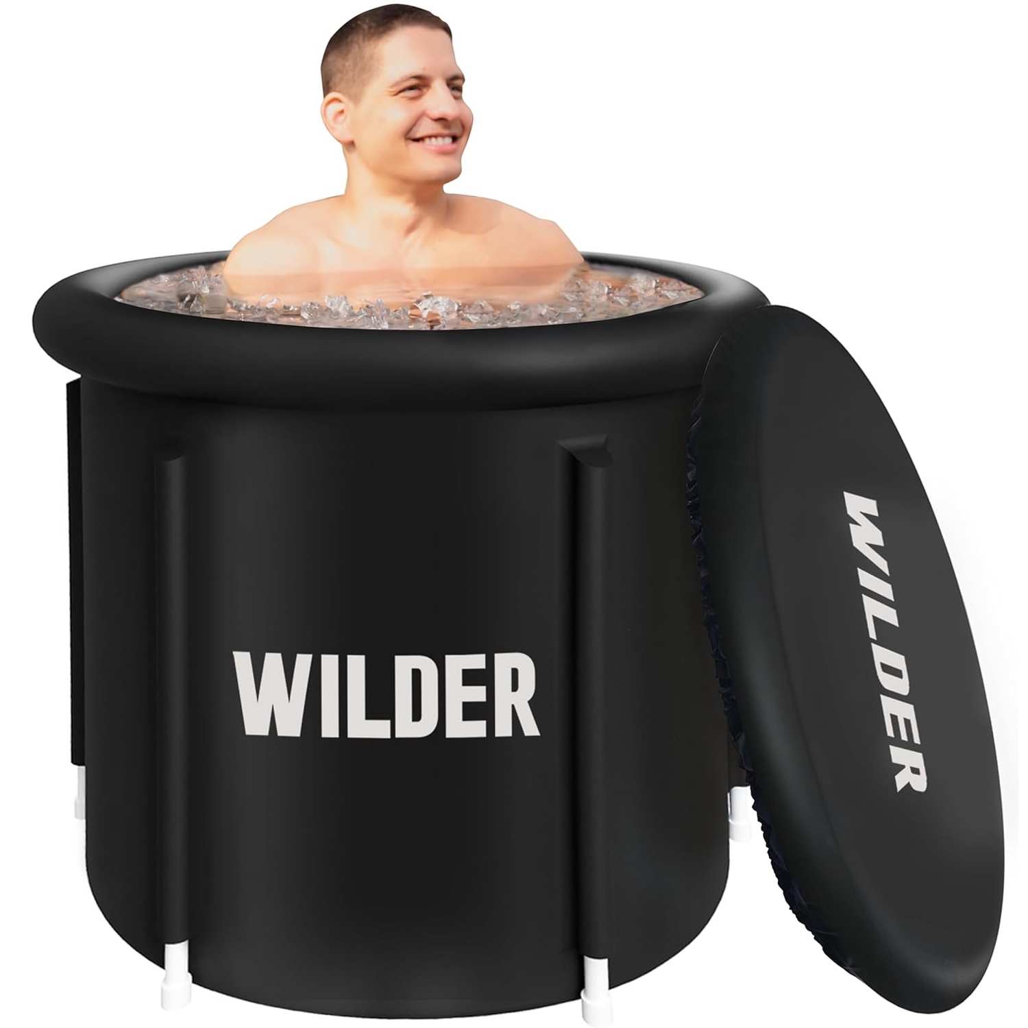 A black Cold Plunge Tub labeled \“WILDER\“ with an open top, filled with ice and a person inside. A matching lid with the same label is positioned beside it.