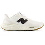 White New Balance sneaker featuring a black \“N\“ logo, Fresh Foam midsole, and gum outsole.