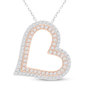 A tilted heart necklace featuring a two-row design with 1 carat of diamonds. It showcases alternating bands of white and rose gold, enhancing its shimmering, elegant appearance.