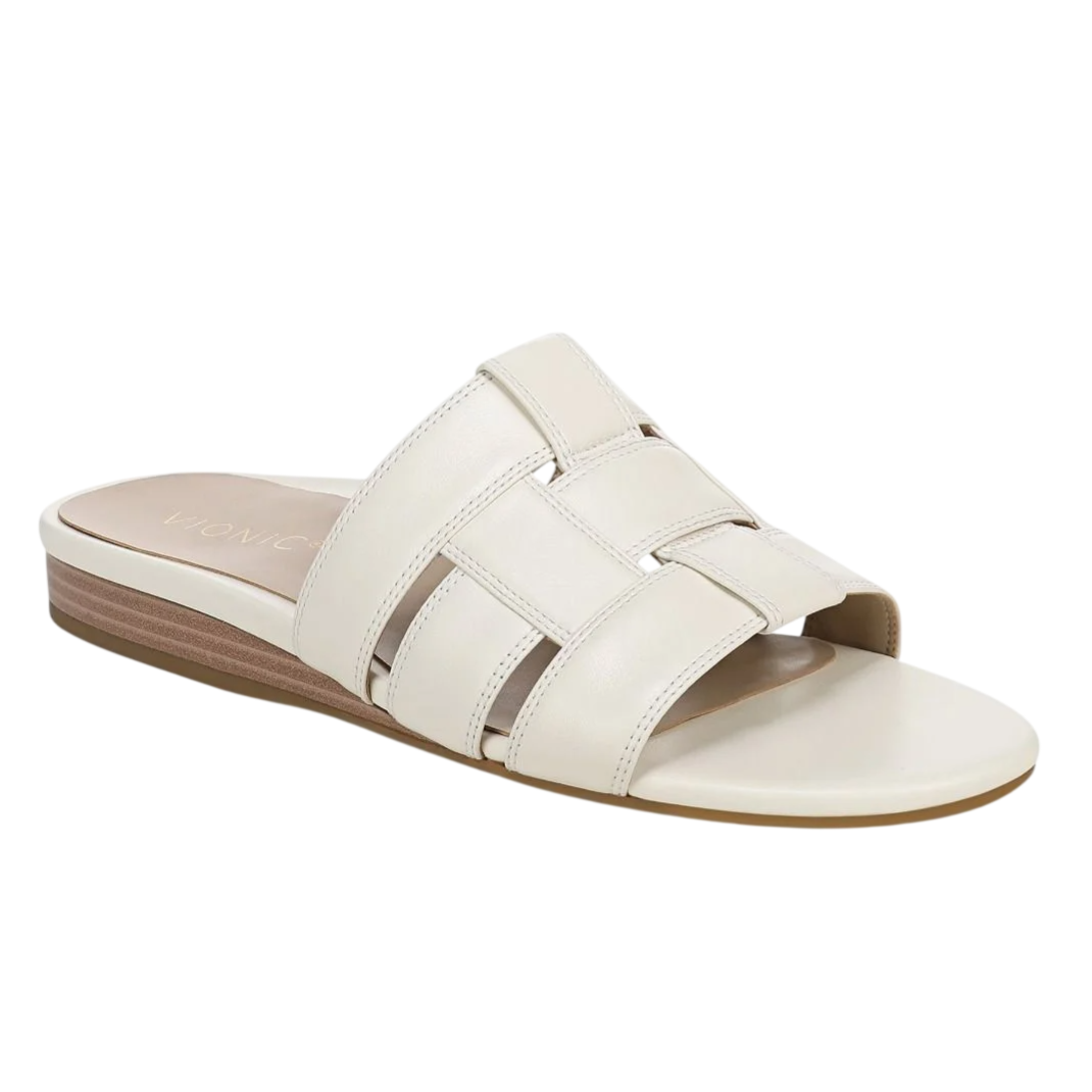 A beige slide sandal featuring a woven strap design and a low-heel sole.