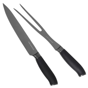The Cook's Essentials Carving Knife Set features a carving knife with a long, sharp blade and a two-pronged meat fork, both with sleek black handles designed for comfort and control.