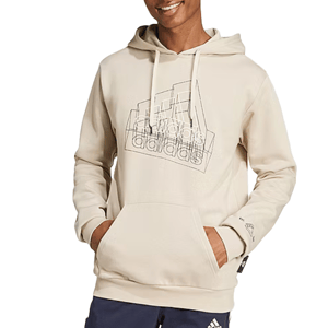A person is wearing a beige Adidas hoodie featuring a geometric design on the front, paired with dark pants displaying a small Adidas logo.
