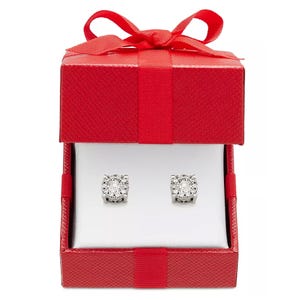 A pair of 1/3 carat diamond cluster stud earrings displayed in a red gift box with a bow, featuring multiple small diamonds set in a circular pattern.