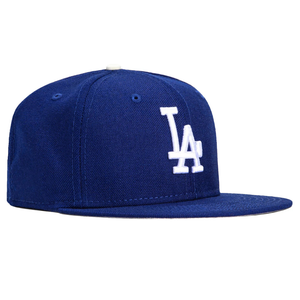 Blue baseball cap with a white \“LA\“ logo embroidered on the front.