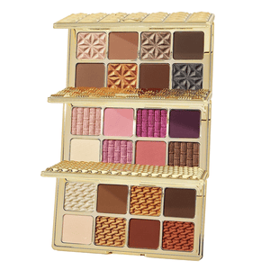 Three-tier gold magnetic palette stack featuring Tarte Amazonian Clay eyeshadows in a mix of matte and shimmer shades ranging from neutrals and browns to pinks and purples, with intricate textures and patterns on each shade.
