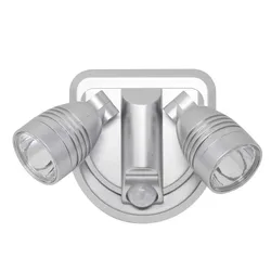Dual-head motion-activated outdoor security floodlight with a silver finish, equipped with two adjustable LED lights and a motion sensor at the center.