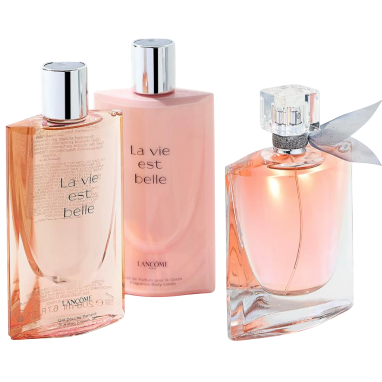 Three \“La vie est belle\“ Lancome products are shown, including perfume and possibly body lotions, arranged on a white surface with jewelry in the background.