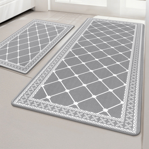 Two gray waterproof anti-fatigue mats with a white geometric grid pattern and decorative border; designed for comfort in standing areas.