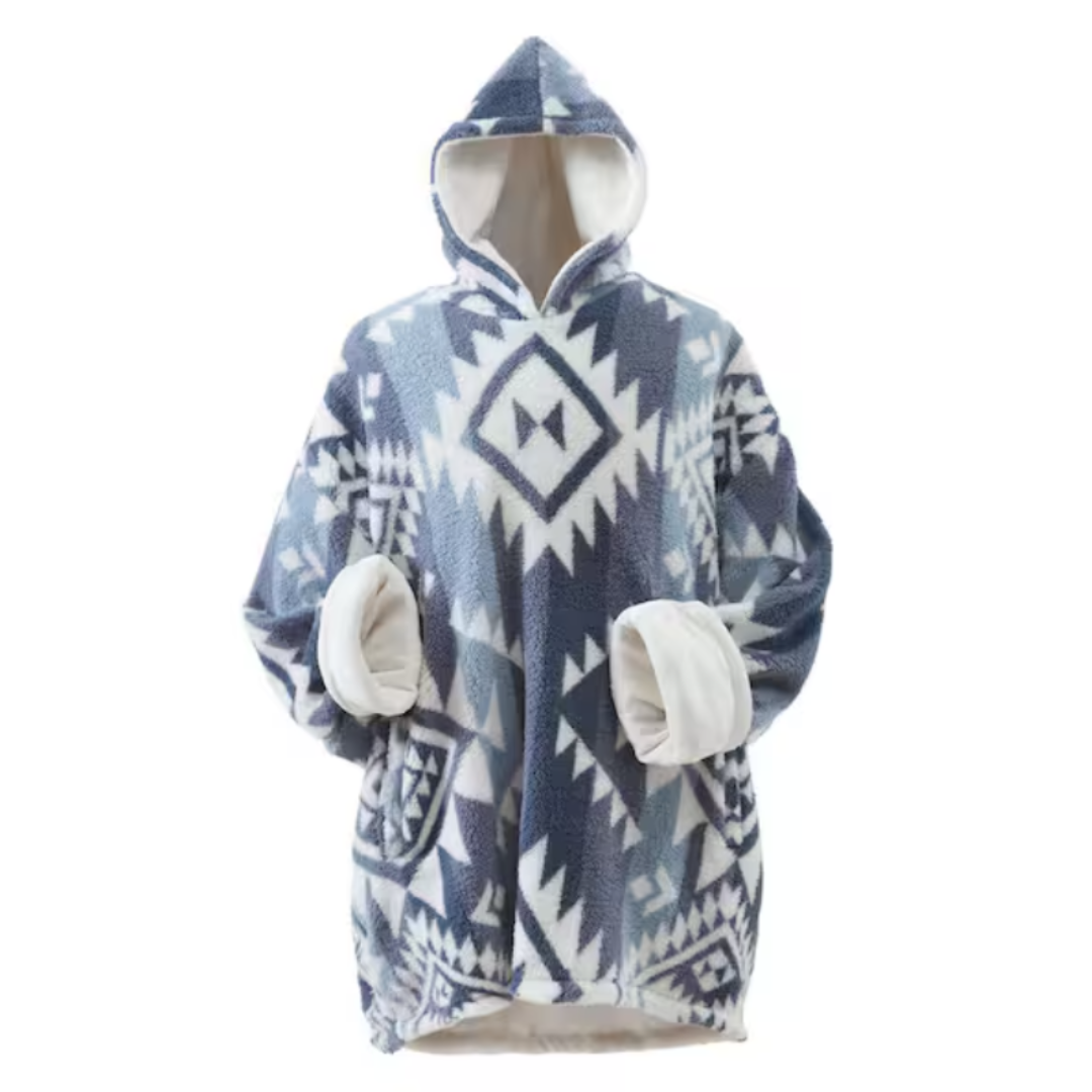 Oversized hooded blanket with a geometric pattern in blue and white, featuring large pockets and a plush, fleece interior.