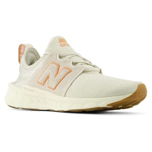 A pair of New Balance sneakers in a light beige color with the brand's 'N' logo on the side.