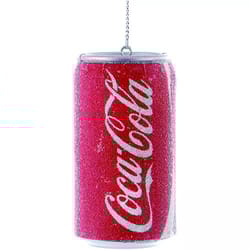A decorative ornament resembling a red Coca-Cola can, featuring a reflective, glittery texture and a hanging chain at the top.